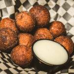 Fresh Donut Holes on Checkered Paper, bear paw bar and grill, events